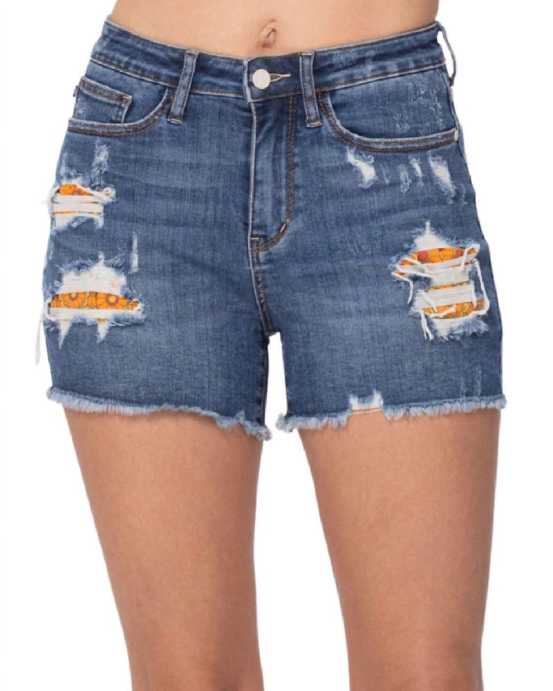 Front of a model wearing a size X-Large Printed Pocket Lining High Rise Cut Off Short In Blue in Blue by Judy Blue. | dia_product_style_image_id:358820